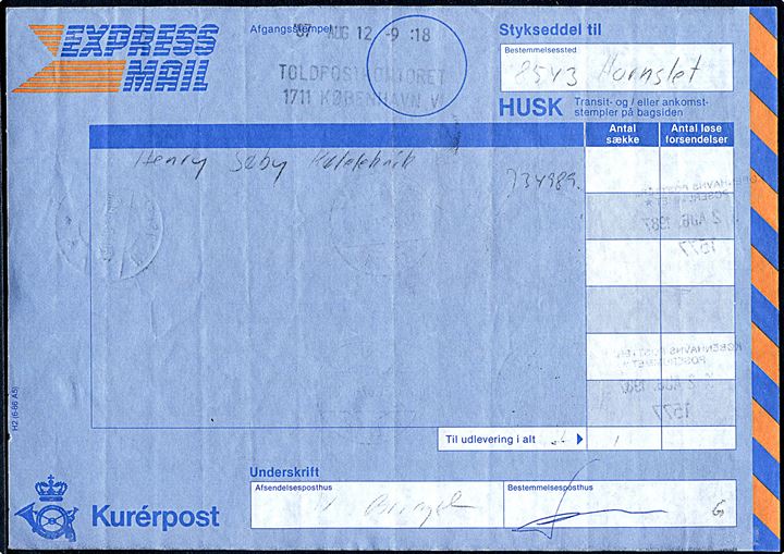 Express Mail stykseddel for forsendelse fra København til Hornslet. På bagsiden transitstempler fra bureauerne København - Fredericia T.0139 og det meget sjældne bureaustempel Fredericia - Aalborg T.0138 d. 12.8.1987. Stemplet med Fredericia - Aalborg (dobbelt Aa) og uden T for Tog blev leveret i 1986 og udskiftet inden aug. 1988 hvor bureaustemplerne blev ændret til de stræknings-anonyme PTJ-stempler.