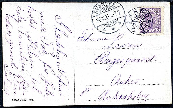 15 øre Chr. X på nytårskort annulleret med stjernestempel AARSDALE sidestemplet Svaneke d. 30.12.1921 til Aaker pr. Aakirkeby.