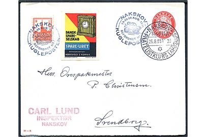 15 øre helsagskuvert (fabr. 51-R) med forskellige mærkater annulleret med udstillingsstempel i Nakskov d. 26.8.1935 og sidestemplet Befordret med Kugleposten til Svendborg.