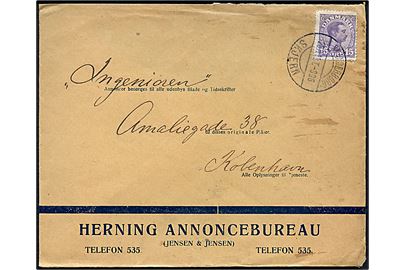 15 øre Chr. X på illustreret firmakuvert fra Herning Annoncebureau annulleret med bureaustempel Skanderborg - Skjern T.996 d. 28.11.1919 til København.