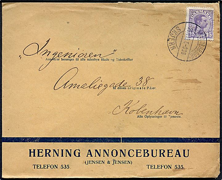 15 øre Chr. X på illustreret firmakuvert fra Herning Annoncebureau annulleret med bureaustempel Skanderborg - Skjern T.996 d. 28.11.1919 til København.