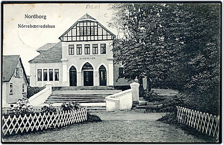 5 pfg. Germania på brevkort (Nørrehærredshus i Nordborg) annulleret med bureaustempel Sonderburg - Norburg Bahnpost Zug 11 d. 27.2.1909 til Flensburg.