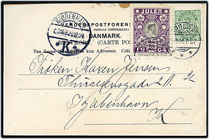 5 øre Våben og Julemærke 1904 på brevkort (Korsør, parti fra Fæstningen) stemplet Korsør d. 25.12.1904 til København. Ank.stemplet Kjøbenhavn K. d. 26.12.1904 0. OMB.