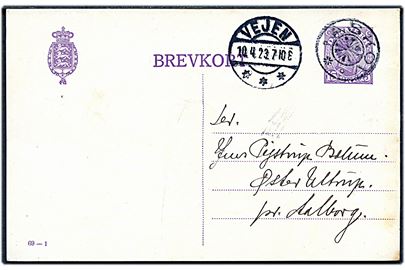 15 øre Chr. X helsagsbrevkort (fabr. 69-I) annulleret med stjernestempel ASKOV og sidestemplet Vejen d. 10.4.1923 til Øster Uttrup pr. Aalborg.
