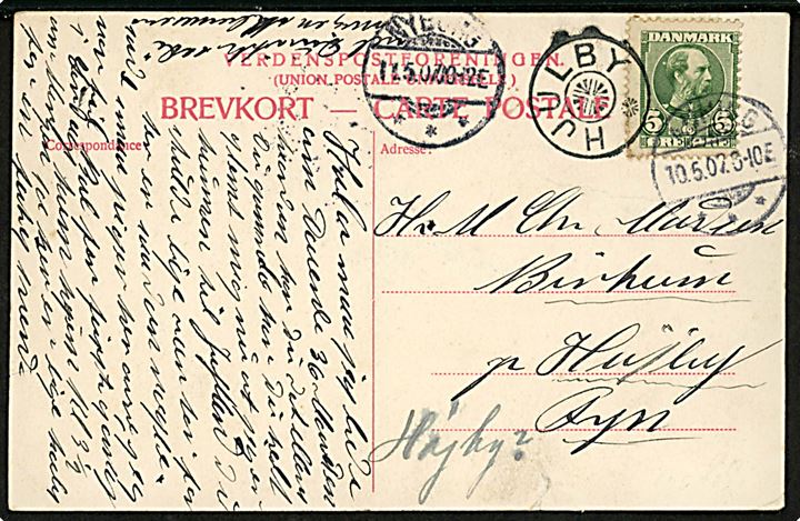 5 øre Chr. IX på brevkort fra Auning d. 10.5.1907 til Højrup på Fyn. Fejlsendt til Hjulby med stjernestempel HJULBY og sidestemple Nyborg d. 11.5.1907.