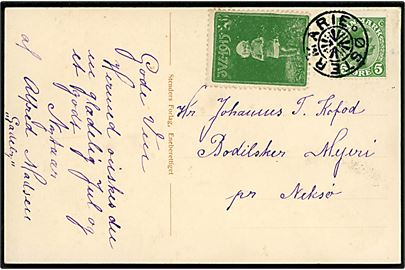 5 øre Chr. X og Julemærke 1915 på julekort annulleret med stjernestempel ØSTERMARIE til Bodilsker Mejeri pr. Neksø.
