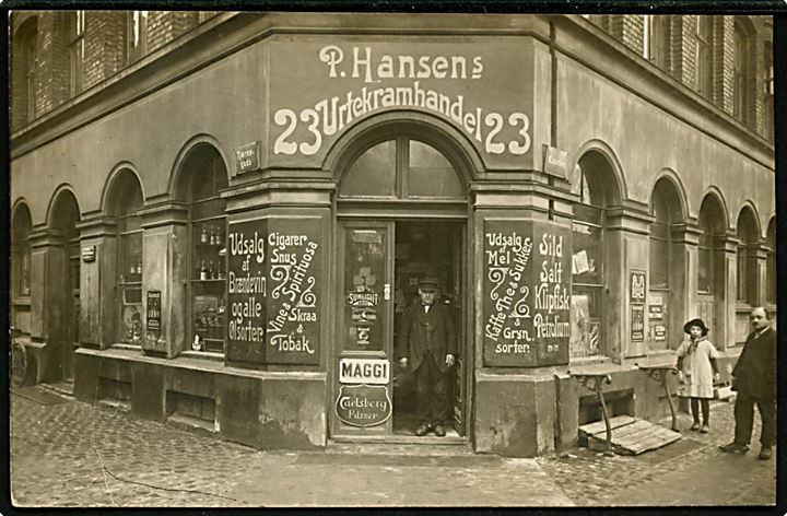 Kapelvej 23 hj. Tjørnegade P. Hansen’s Urtekramhandel. Fotokort u/no.  Kvalitet 9