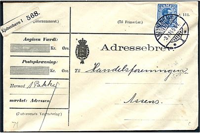 20 øre Chr. X på adressebrev for pakke fra Kjøbenhavn d. 3.7.1914 til Assens. På bagsiden mærkat for Fugleflugts-Linien.