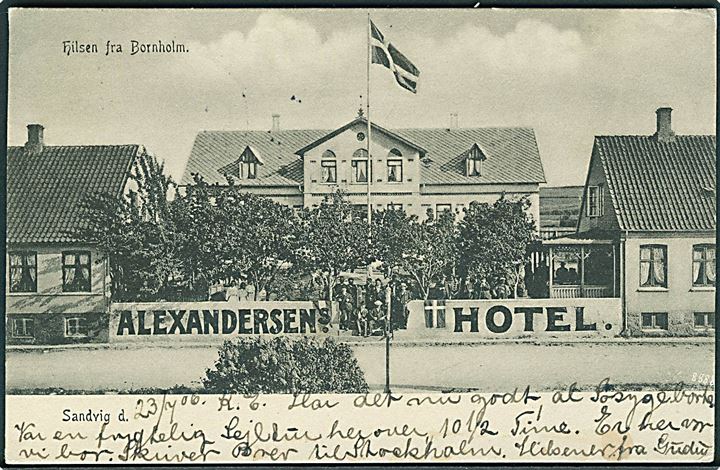 5 øre Chr. IX på brevkort (Alexandersens Hotel i Sandvig) annulleret med stjernestempel SANDVIG og sidestemplet Allinge d. 23.7.1906 til søkaptajn ombord på Ångf. Oscar den II i Hudiksvall, Sverige.