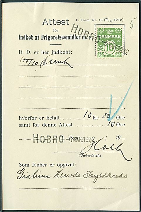 10 øre Bølgelinie annulleret med liniestempel Hobro d. 6.3.1922 på Attest for Indkøb af Frigørelsesmidler m.v.  F. Form. Nr. 43 (28/10 1919). Fortrykt gebyr ændret fra 5 til 10 øre.