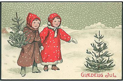 Glædelig Jul. Pige iført rød og brune jakker i snevejr. P. Hansen, serie 507/1.