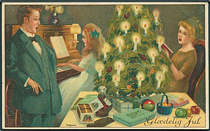 Glædelig Jul. Familien synger ved juletræet. U/no. 