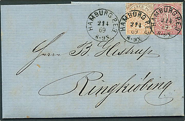 ½ gr. stukken kant og 1 gr. takke på blandingsfrankeret brev fra Hamburg d. 2.4.1869 til Ringkjøbing, Danmark. Særtakst fra Hertugdømmerne til Danmark.