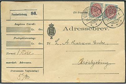 12 øre Tofarvet i vandret parstykke på adressebrev for pakke annulleret Frederiksborg d. 11.8.1900 til Ærøskjøbing.