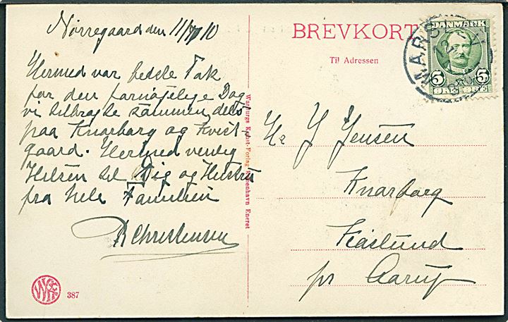 Ravnholt set fra indkørslen. Warburgs Kunstforlag no. 387. Frankeret med 5 øre Fr. VIII annulleret lapidar Marslev d. 12.7.1910 til Aarup.