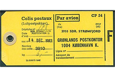 Gult Manila-mærke for sæk med luftpostpakker - formular 22-3210-75 BAE - anvendt fra Sdr. Stømfjord d. 14.12.1983 til Grønlands Postkontor i København.