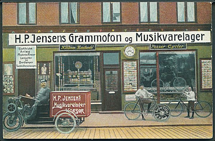 Korsør, “H. P. Jensens Grammafon & Musikvarelager” med 3-hjulet motorcykel. H. P. Jensen u/no. Kvalitet 8