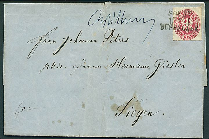 1 sh. stukken kant på brev annulleret med bureaustempel Soest - Düsseldorf f. 12.1.18xx og ulæselig håndskrevet bynavn til Siegen.