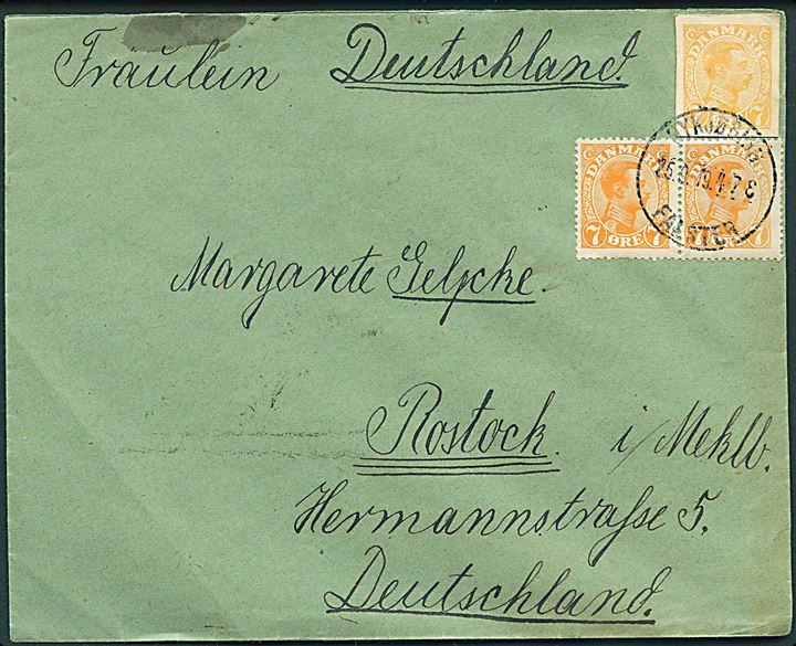 7 øre Chr. X i parstykke og 7 øre Chr. X helsagsafklip på brev fra Nykjøbing Falster d. 25.9.1919 til Rostock, Tyskland. Overfrankeret med 1 øre.