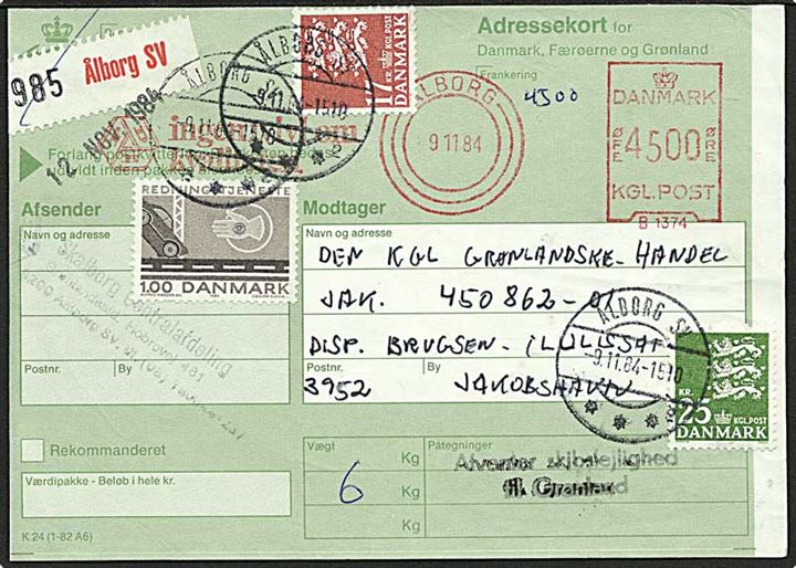 45 kr. firmafranko frankeret adressekort opfrankeret med 1 kr. Redningstjeneste, 17 kr. og 25 kr. Rigsvåben fra Ålborg SV d. 9.11.1984 til Jakobshavn, Grønland. Stemplet: Afventer skibslejlighed til Grønland.