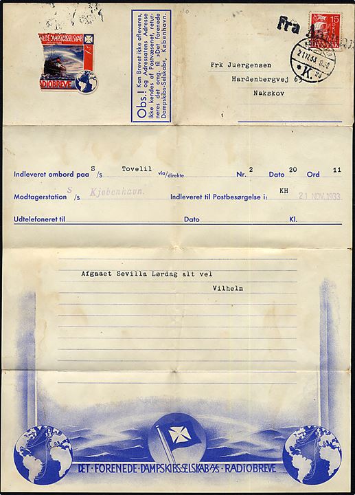 15 øre Karavel på DFDS Radiobrev formular med meddelelse fra S/S Tovelil i Spanien modtaget ombord på provinsbåden S/S Kjøbenhavn annulleret Fra Aalborg og sidestemplet København d. 21.11.1933 til Nakskov.