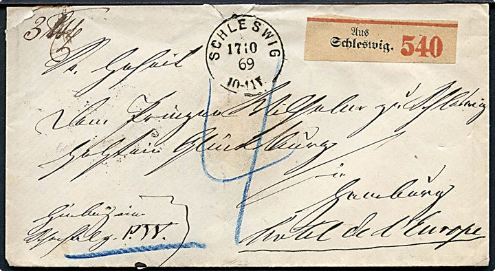 Ufrankeret pakkefølgebrev fra Schleswig d. 17.10.1869 til Prinz Wilhelm zu Schleswig-Holstein Glücksburg på Hotel Europa i Hamburg. Prins Wilhelm var kong Chr. IX's storebror. På bagsiden royalt laksegl.