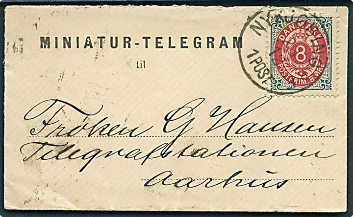 8 øre Tofarvet på lille fortrykt “Miniature-Telegram” kuvert annulleret med lapidar Nykjøbing p. F. d. 23.12. ca. 1890 til Telegrafstationen i Aarhus. Dekorativ.