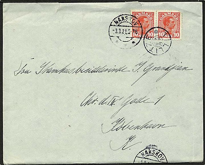 10 øre Chr. X i parstykke (ene mærke med mgl. hjørne) på brev annulleret med stjernestempel TILLITZE og sidestemplet Nakskov d. 3.3.1921 til København.