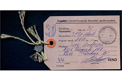 Manila-mærke for Beskadiget Værdiforsendelse - F32 (10-68) - for værdibrev fra Thule stemplet Grønlands Postkontor København K. d. 7.3.1981 til Aarhus. Vedhængende blyplombe.