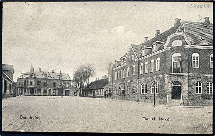 5 øre Fr. VIII på brevkort (Torvet i Neksø) annulleret Nexø d. 2?.12.1909 til Rønne. Ank.stemplet med stjernestempel AARSBALLE.