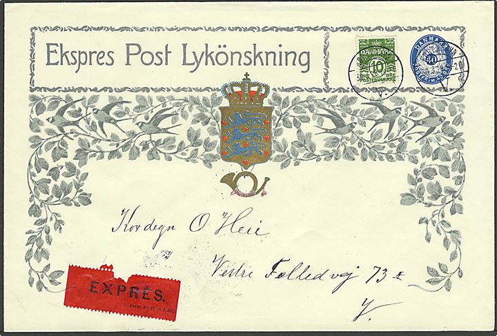 40 øre Ekspres Post Lykönsknings kuvert, m. blad-ornament, opfrankeret med 10 øre Bølgelinie og sendt lokalt i København d. 30.3.1928. Meget sjælden helsag i luksus kvalitet.