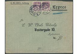 15 øre Bølgelinie i parstykke på fortrykt ekspresbrev fra firma C.W.Obel i Aalborg d. 29.11.1913 til Kjøbenhavn. På noteret: “Forsøgt afleveret kl. 9 1/4”. Bagklap mgl.