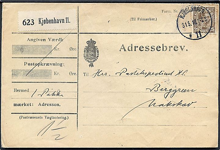 25 øre Chr. X med perfin POL på adressekort for pakke fra Politikens Bibliotek i Kjøbenhavn d. 31.5.1918 til Nakskov.