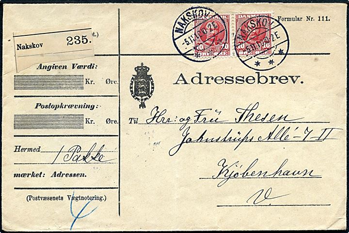 10 øre Fr. VIII i parstykke på adressebrev for pakke fra Nakskov d. 5.11.1910 til København. Lodret fold.