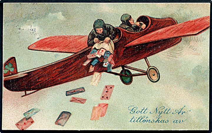Gott Nytt År, tillønskas av. Sækken tømmes for breve i flyvemaskine. No. 3571 K. 11 x 6,8 cm.