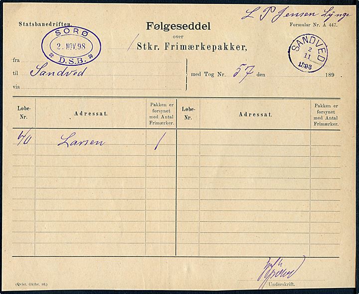 Statsbanedriften Følgeseddel for Frimærkepakker formular A447 med violet ovalt stempel Sorø * D.S.B. * d. 2-11-1898 til Sandved. Ank.stemplet med violet lapidar VI Sandved d. 2.11.1898.