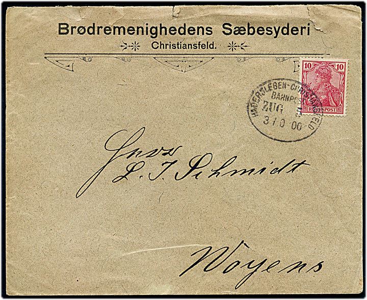 10 pfg. Germania på fortrykt kuvert fra Brødremenighedens Sæbesyderi i Christiansfeld annulleret med bureaustempel Hadersleben - Christiansfeld Bahnpost Zug 5 d. 30.10.1900 til Woyens.