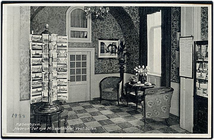 Købh., Det nye Missionshotel Hebron, vestibulen med postkortstativ. R. Olsen no. 8228.