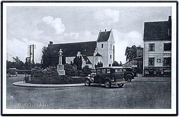 Fuglebjerg, kirken og hjørne af fotoforretning, samt et par gamle biler. Stenders no. 75624.