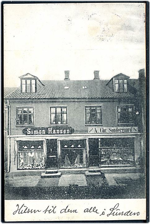 Odder. Gadefacader med Simon hansen og Guldsmed N. Chr. Søndergaard's butikker. J.J.N. no. 986.