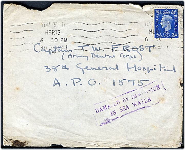 2½d George VI på brev fra Hatfield d. 30.12.1941 til tandlæge Capt. Frost ved 38th General Hospital, A.P.O. 1575 (Transit adresse i forbindelse med troppetransport). 38th General Hospital blev forlagt fra England til Basra, Irak med H.M.T. Lancashire og siden overført til Indien. Violet rammestempel: Damaged by immersion in sea water på for- og bagside.