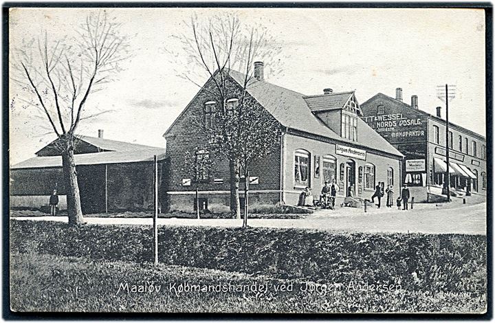 Måløv, Købmandshandel ved Jørgen Andersen, samt reklame for Vett & Wessels udsalg. Frederiksberg Postkortlager no. 18695. Kvalitet 7