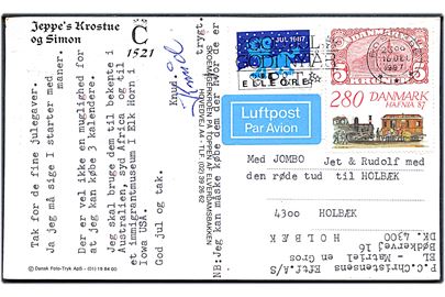 280 øre Hafnia 87 udg. og Elleore Julemærke 1987 på brevkort fra Roskilde d. 16.12.1987 til Holbæk.