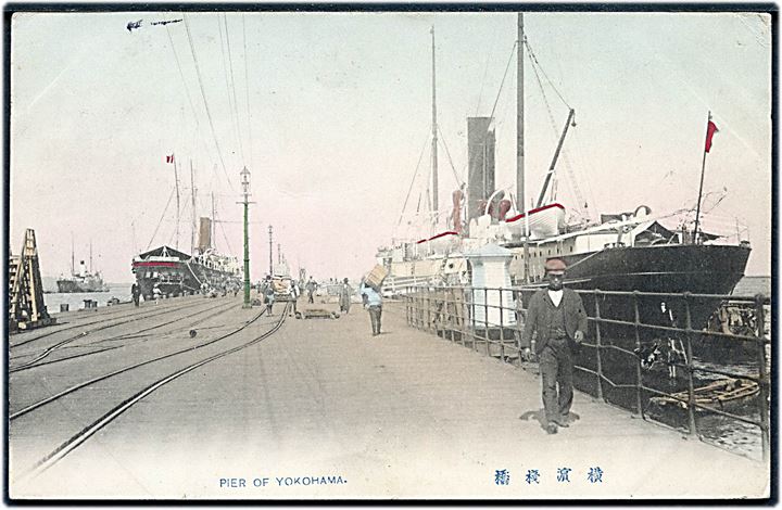 Japan, Yokohama, havnekaj med dampskibe. Frankeret med 4 sn. og sendt fra Yokohama d. 26.2.1906 til England.