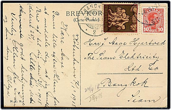 10 øre Chr. X og Julemærke 1917 på brevkort dateret d. 7.1.1918 fra og stemplet Kjøbenhavn Str. d. 7.2.1918 (muligvis fejlindstillet måned) til Bangkok, Siam. Ank.stemplet i Bangkok d. 24.4.1918. Sjælden udlands anvendelse af Julemærke 1917. 