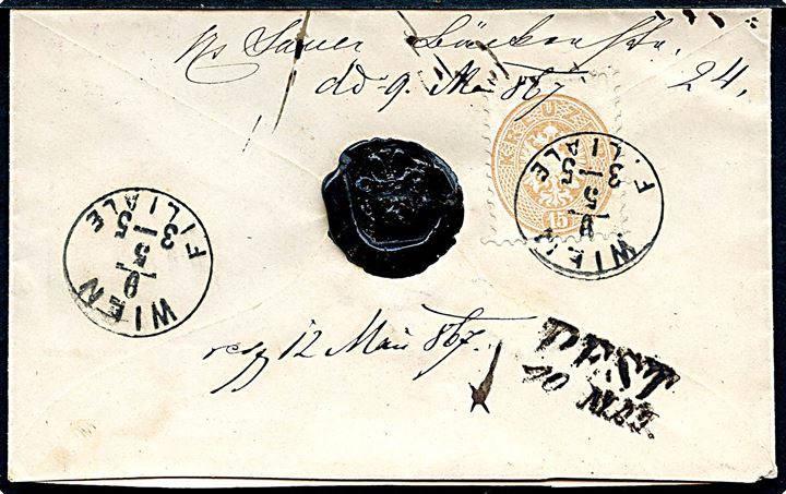 15 kr. Våben single på bagsiden af anbefalet brev fra Wien d. 9.5.1867 til Pest, Ungarn. Ank.stemplet PEST d. 10.5.1867.