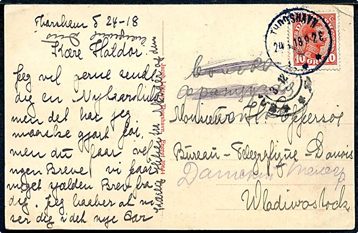 10 øre Chr. X på brevkort (Sumbø fyr) annulleret Thorshavn d. 24.11.1918 til færøsk telegrafist Haldor Effersøe ved Store Nordiske Telegraf i Vladivostok, Sibirien. Ank.stemplet d. 3.12.1918 (Julianske kalender) = 16.12.1918.