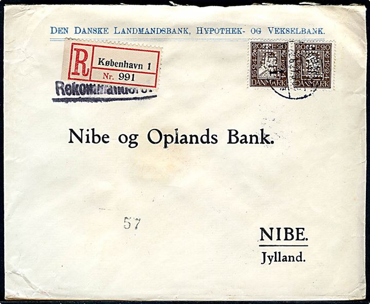 20 øre Chr. IV og 20 øre Chr. X Postjubilæum i sammentryk med perfin LB på fortrykt kuvert fra Den danske Landmandsbank sendt anbefalet fra København d. 22.6.1927 til Nibe.