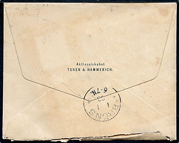 5 øre Våben på tryksag med rødt ovalt stempel Trykt fra Kjøbenhavn V. d. 31.12.1897 til Bröns, Sønderjylland. Ank.stemplet Bröns d. 1.1.1898.