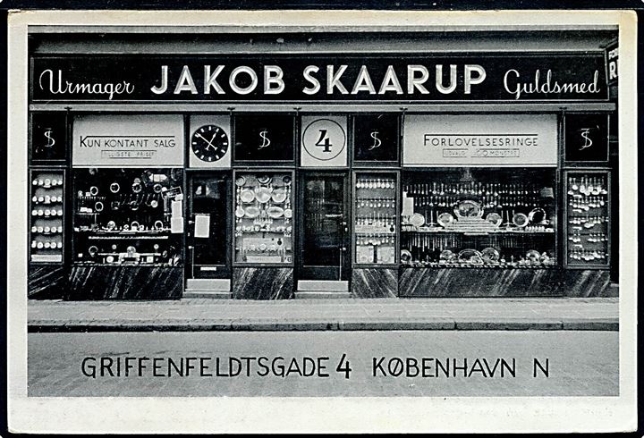 Griffenfeldtsgade 4 med Jakob Skaarup’s urmager og guldsmede forretning. Reklamekort. Kvalitet 7